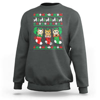 Gray crewneck sweatshirt with cute cat-in-socks Christmas graphic.