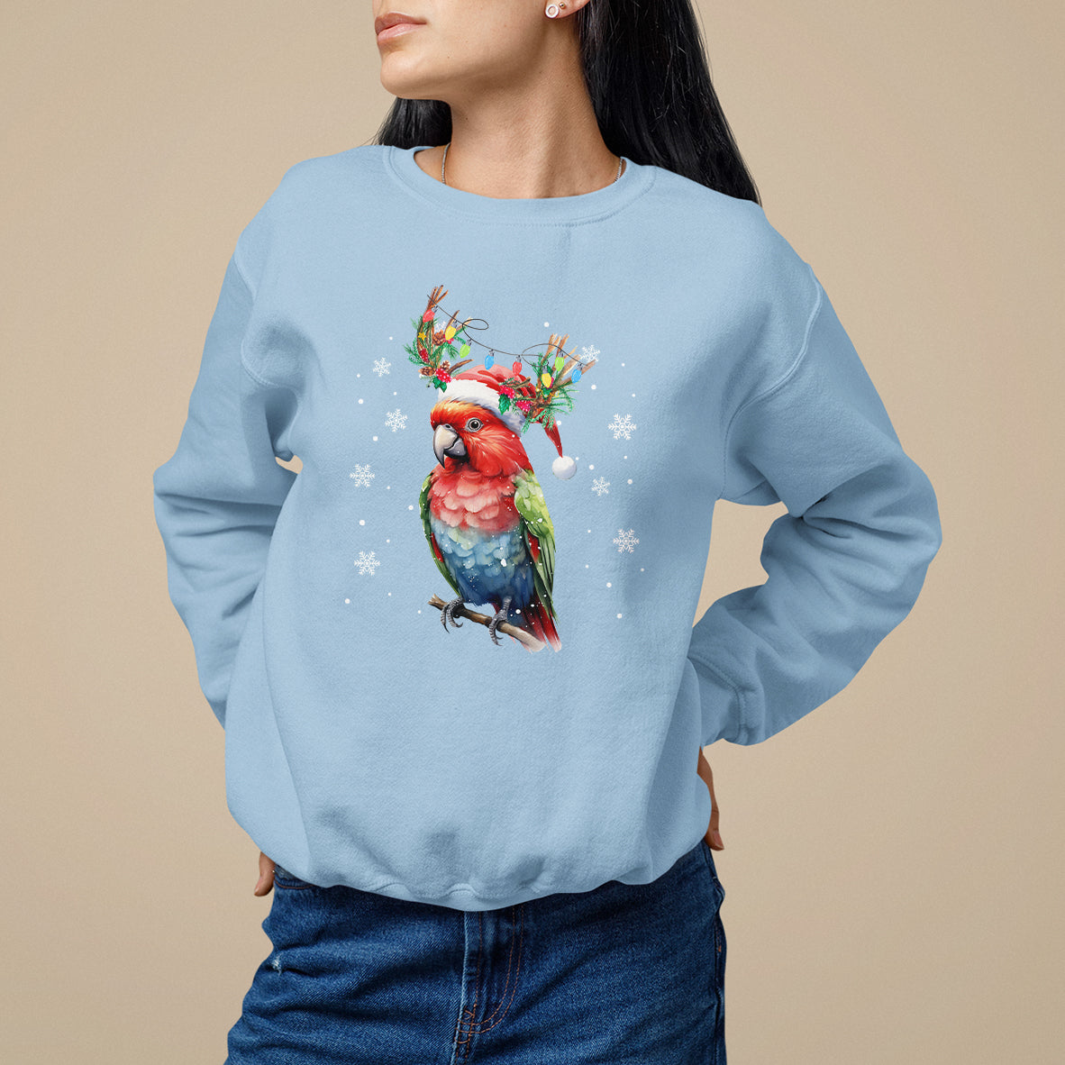 Light blue Christmas sweatshirt with colorful parrot graphic and snowflake print