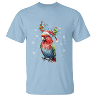 Light blue crewneck T-shirt with colorful Christmas parrot graphic and snowflake accents
