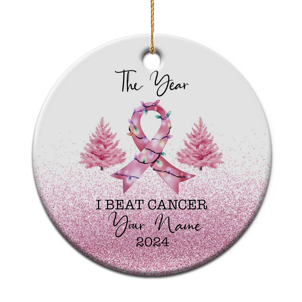 Round breast cancer awareness ornament with pink glitter, ribbon figure, and “I BEAT CANCER” text