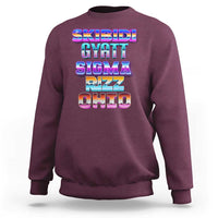 Maroon crewneck sweatshirt with colorful “SKIBIDI GYATT SIGMA RIZZ OHIO” graphic on back