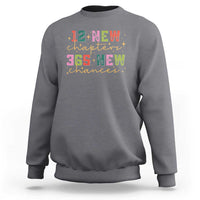 Charcoal gray crewneck sweatshirt with colorful "12 New chapters" and "365 New chances" graphic