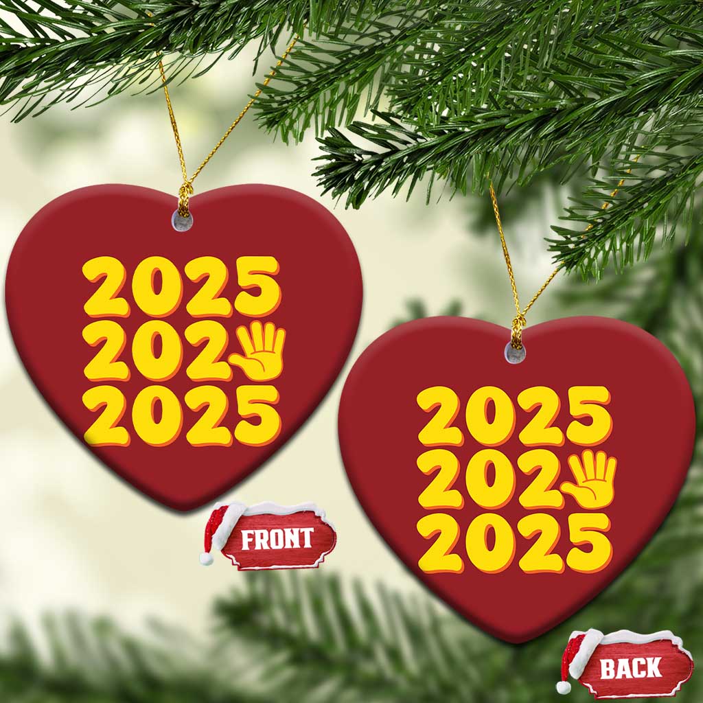 Red heart-shaped 2025 ornament with yellow “2025” text and handprint icon
