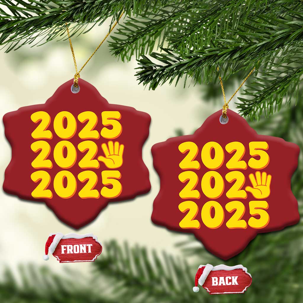 Two red heart-shaped 2025 ornaments with yellow “2025” and handprint icon