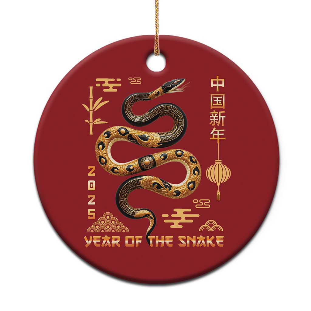 Red round Christmas ornament with gold snake and Year of the Snake design