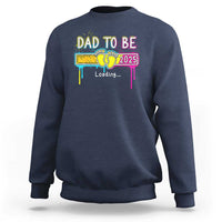 Navy sweatshirt with “Dad to Be 2025” colorful loading graphic on front