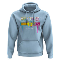 Light blue maternity hoodie with “Mom to Be” 2025 graphic, front kangaroo pocket, hood.