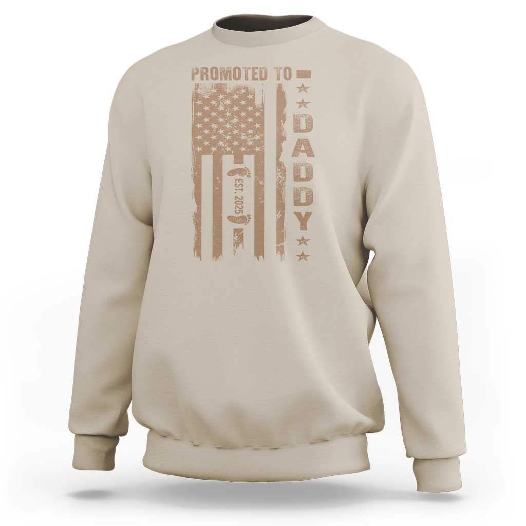 Sand-colored crewneck sweatshirt with “Promoted to Daddy” graphic on the front