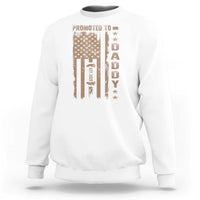 White crewneck sweatshirt with “Promoted to Daddy” graphic on the front