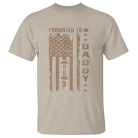 Sand dad T-shirt with distressed “Promoted to Daddy” graphic on chest