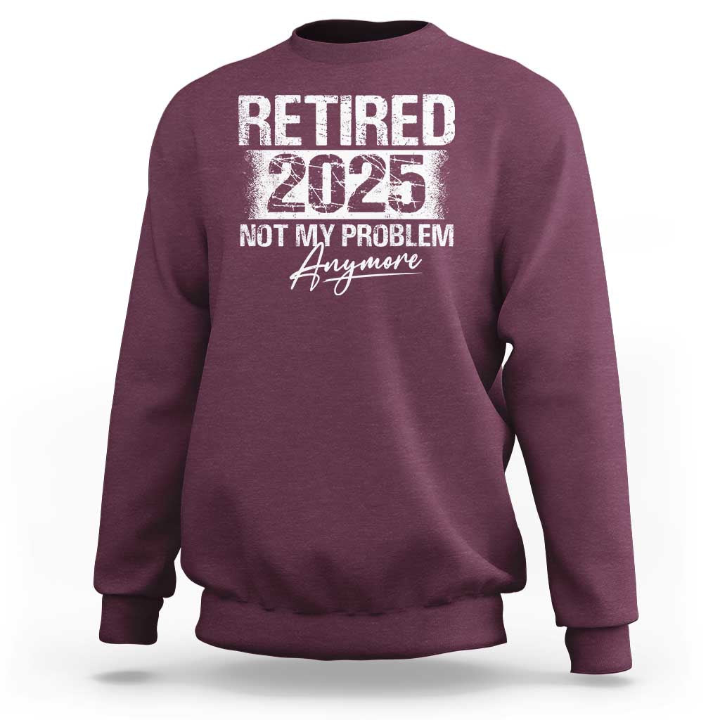 Maroon crewneck sweatshirt with 'Retired 2025' and 'Not My Problem' graphic