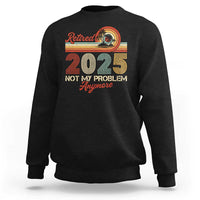 Black crewneck retirement sweatshirt with “Retired 2025” graphic and “Not My Problem Anymore” text