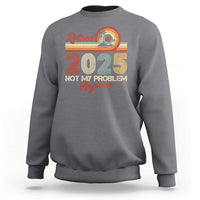 Charcoal crewneck retirement sweatshirt with “Retired 2025” graphic and “Not My Problem Anymore” text