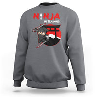 Charcoal gray ninja training sweatshirt with ninja character and sword graphic on the back