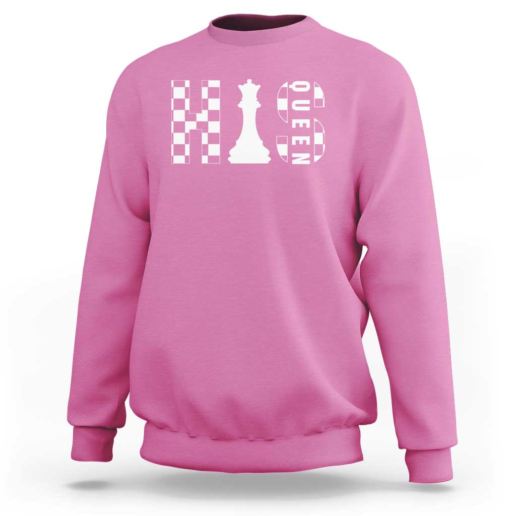 Pink crewneck sweatshirt with white chessboard and queen graphic on the chest