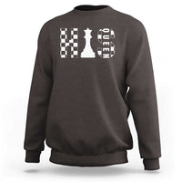 Charcoal crewneck sweatshirt with white chessboard and queen graphic on the chest