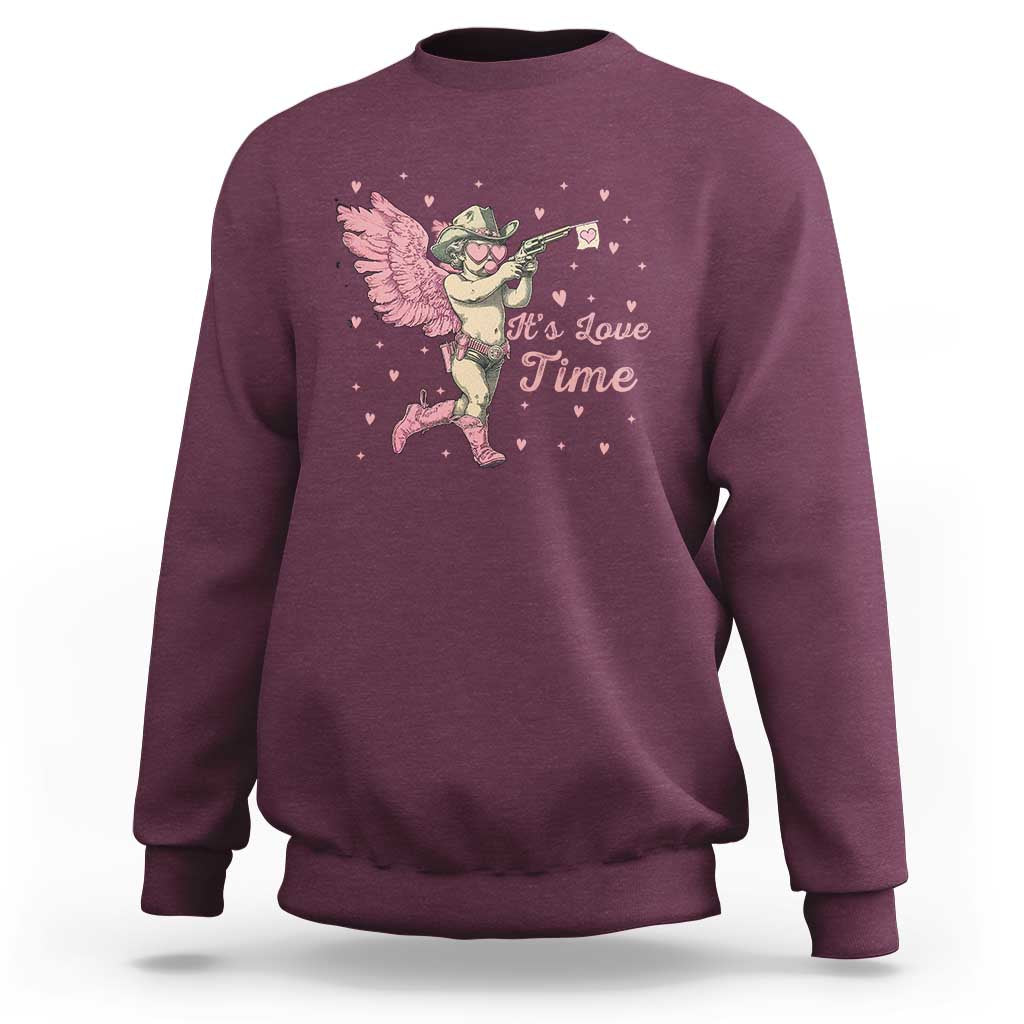 Maroon crewneck sweatshirt with pink cowboy cupid graphic and 'It's Love Time' text.