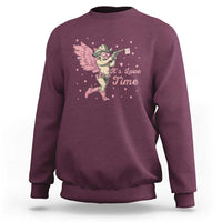 Maroon crewneck sweatshirt with pink cowboy cupid graphic and 'It's Love Time' text.
