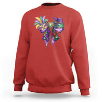 Red Mardi Gras sweatshirt with colorful jester-mask graphic on the chest