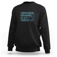 Black crewneck sweatshirt with teal 'Crunching numbers is my cardio' graphic