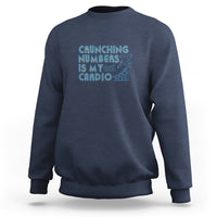 Navy crewneck sweatshirt with teal 'Crunching numbers is my cardio' graphic