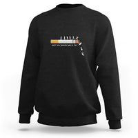 Black long-sleeve sweatshirt with centered graphic and ribbed crewneck cuffs.
