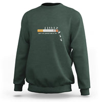 Dark forest green long-sleeve sweatshirt with centered graphic and ribbed crewneck cuffs.