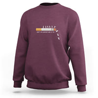 Maroon long-sleeve sweatshirt with centered graphic and ribbed crewneck cuffs.
