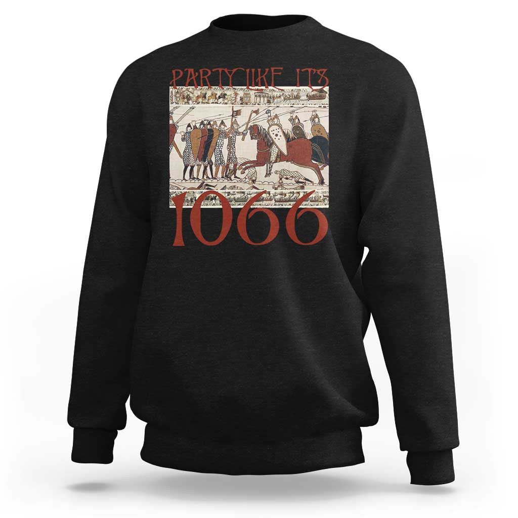 Black crewneck sweatshirt with tapestry graphic and 'Party Like It's 1066' print.
