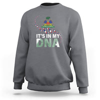 Gray crewneck sweatshirt with colorful “It’s in My DNA” graphic on chest