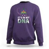 Purple crewneck sweatshirt with colorful “It’s in My DNA” graphic on chest
