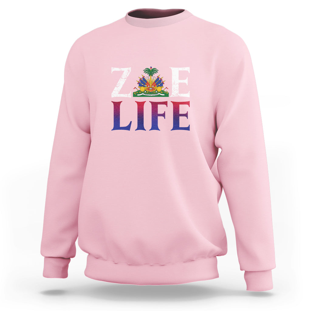 Light pink crewneck sweatshirt with 'ZOE LIFE' patriotic graphic on chest