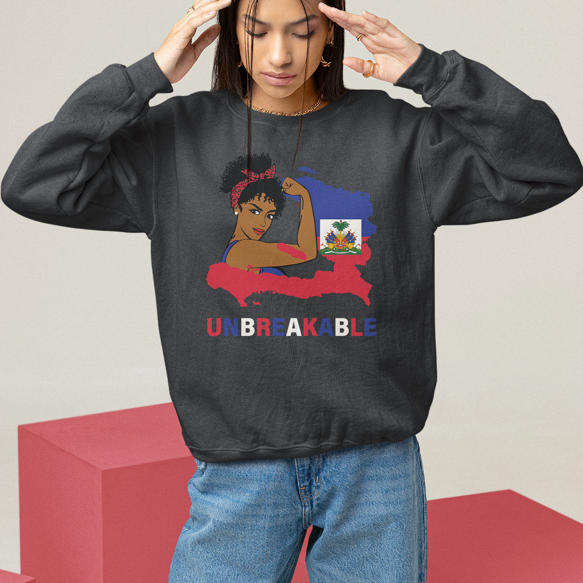 Gray crewneck sweatshirt featuring a seated woman illustration and Haitian map design.