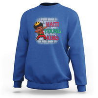 Royal blue kids sweatshirt with “HAITI YOUNG KING” graphic and cartoon character on front