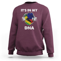 Maroon crewneck sweatshirt with “It's in My DNA” graphic on the front