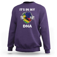 Purple crewneck sweatshirt with “It's in My DNA” graphic on the front