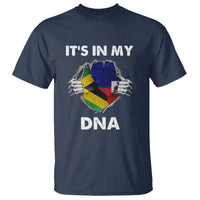 Navy T-shirt with “IT’S IN MY DNA” graphic and hands holding a Jamaican flag heart
