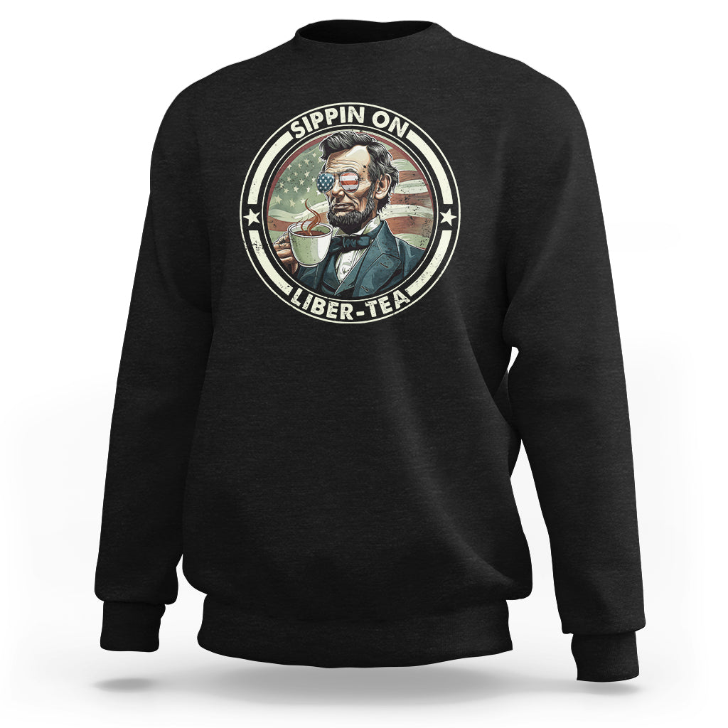 Black crewneck sweatshirt with Abraham Lincoln sipping tea graphic
