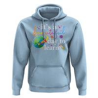 Light blue teacher hoodie with colorful “it’s a beautiful day to learn” globe graphic and front pocket