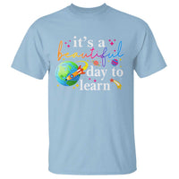 Light blue teacher T-shirt with "it's a beautiful day to learn" graphic
