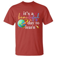 Red teacher T-shirt with "it's a beautiful day to learn" graphic