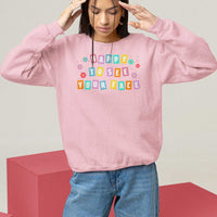 Light pink teacher sweatshirt with 'Happy To See Your Face' colorful front print