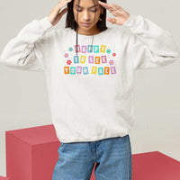 White teacher sweatshirt with 'Happy To See Your Face' colorful front print