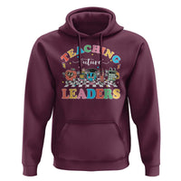 Purple pullover hoodie with 'Teaching Future Leaders' graphic and front pocket