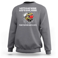 Heather gray kids sweatshirt with crew neck and “punctuation saves lives” graphic