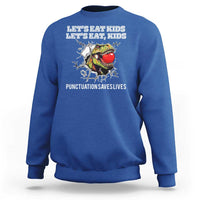 Royal blue kids sweatshirt with crew neck and “punctuation saves lives” graphic