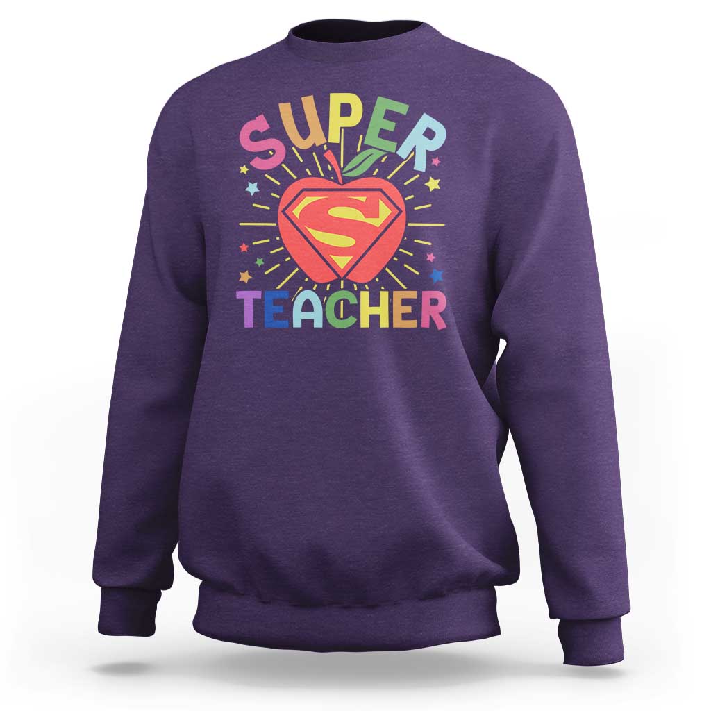 Purple sweatshirt with “Super Teacher” superhero heart graphic on the chest