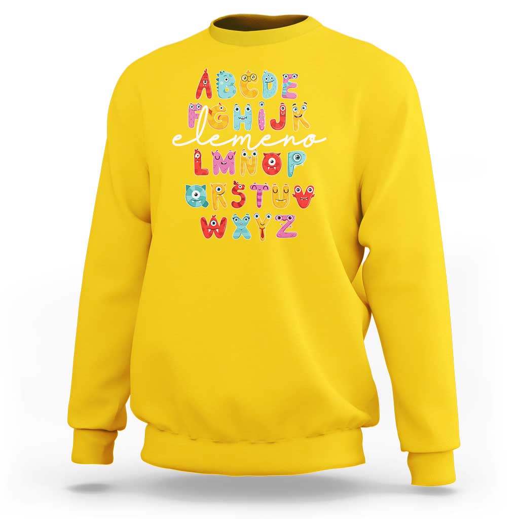 Yellow sweatshirt with cute monster alphabet A–Z graphic on front.