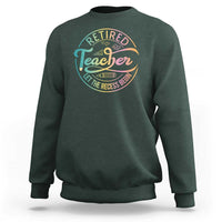 Dark forest green crewneck sweatshirt with “Retired Teacher” circular graphic on the chest