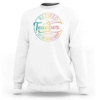 White crewneck sweatshirt with “Retired Teacher” circular graphic on the chest